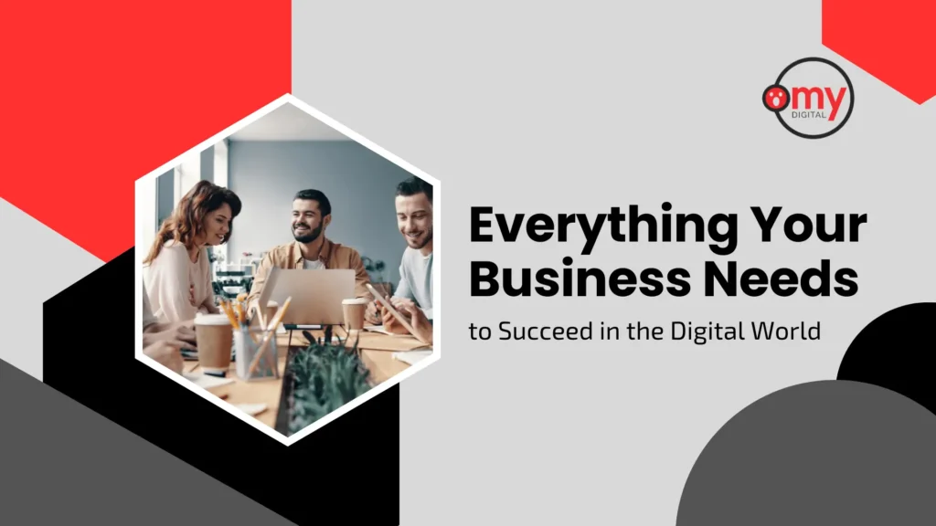 A modern digital guide banner by Omy Digital with a light gray background, framed by bold red, black, and dark gray geometric block shapes along the left side, top right corner, and bottom right corner. On the left side, framed inside a white-bordered hexagonal cutout, a stock photo shows a diverse team of three colleagues sitting around a conference table with laptops, notebooks, coffee cups, and office supplies, smiling and collaborating. On the right side, the official Omy Digital circular logo sits in the top right corner above prominent black headline typography reading "Everything Your Business Needs" and a subheadline reading "to Succeed in the Digital World".