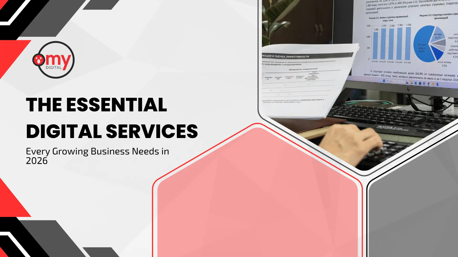 Modern corporate blog banner set against a light grey background with bold red and black geometric corner accents. On the upper left side, the circular "omy DIGITAL" logo is displayed featuring its signature red icon framed inside a black ring. Below the logo, bold black capitalized text reads "THE ESSENTIAL DIGITAL SERVICES" above smaller secondary text stating "Every Growing Business Needs in 2026". On the right side, dynamic hexagonal graphic frames overlay an office scene showing a hand operating a desktop computer with bar charts and data analytics displayed on the screen while holding printed reports. A large, translucent red-outlined hexagonal polygon sits in the bottom center foreground to balance the layout.